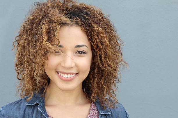 istock Professional female model with curly hair posing 588367004
