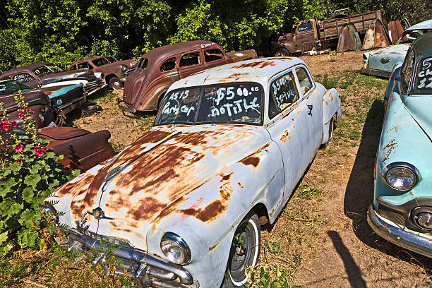 Orderville, United States - July 17, 2008: junk yard with old beautiful oldtimers on the route 89  in Orderville, USA. America is a spot for european classic car hunters.