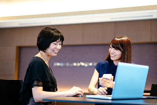 istock Successful Japanese female managers deciding on investment proposals. 588367868