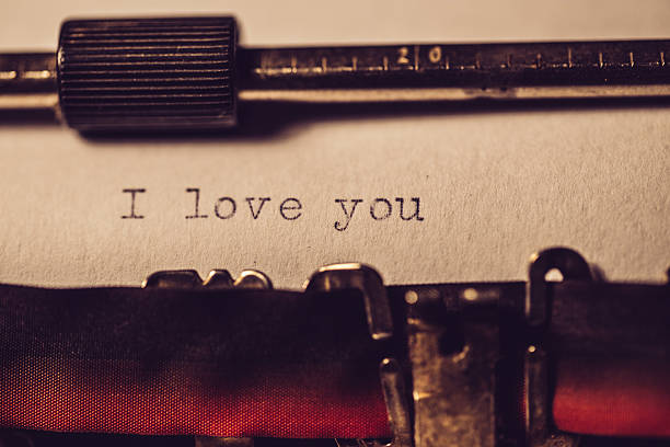 'i love you' typed using an old typewriter - typewriter typebar old macro imagens e fotografias de stock