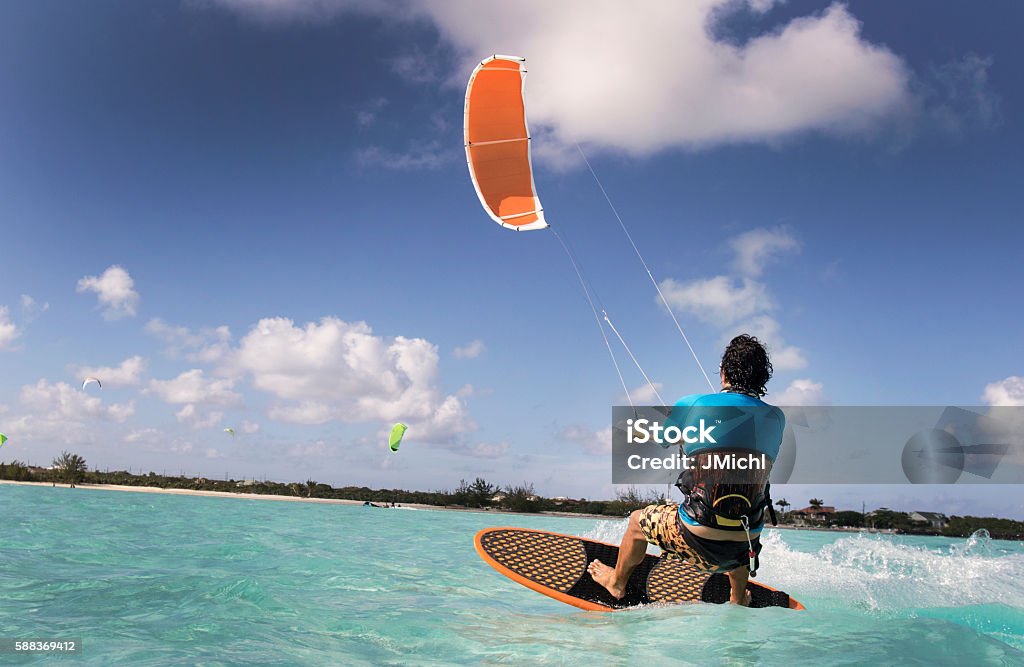 Kite Surfing Man In The Caribbean A man kite surfing in the Caribbean. Kiteboarding Stock Photo
