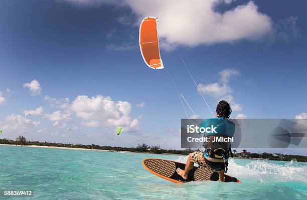 Kite Surfing Man In The Caribbean Stock Photo - Download Image Now - Kiteboarding, Caribbean Sea, Kiteboard