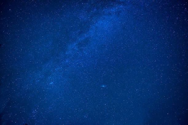 istock Blue dark night sky with many stars 588369752