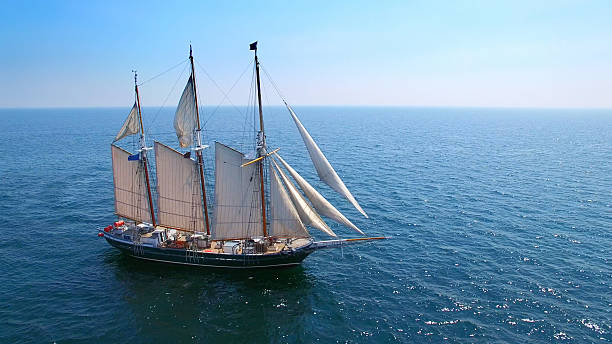 istock Tall ship sailing the open sea on sunny day 588372872