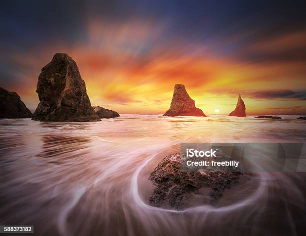 Three Sisters With One Sun Stock Photo - Download Image Now - Bandon, Beach, Beauty