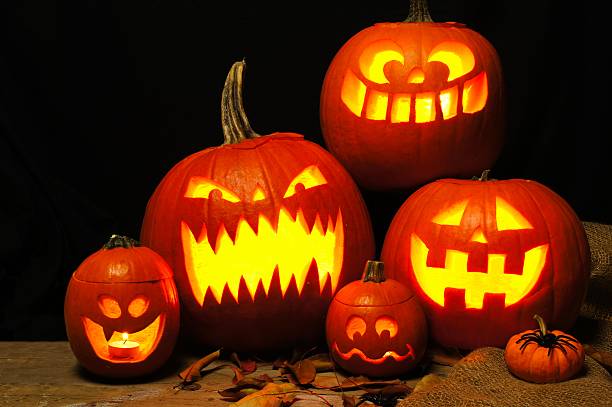 istock Halloween night scene with spooky Halloween Jack o Lanterns 588374676