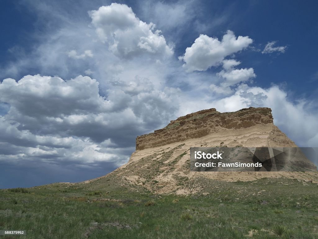Pawnee Buttes A butte rising up out of the expanse of the Pawnee National Grasslands, a striking feature in the desolate landscape of eastern Colorado. Butte - Rocky Outcrop Stock Photo