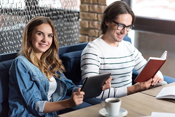 istock Positive colleagues sitting in the cafe 588376376