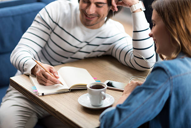 istock Pleasant couple sitting in the cafe 588376672