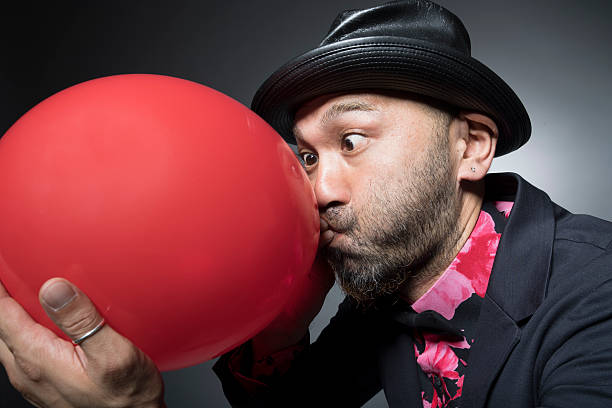 istock Men inflated the balloon to hard 588383566