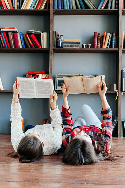 istock Students laying on floor and using books together 588383942