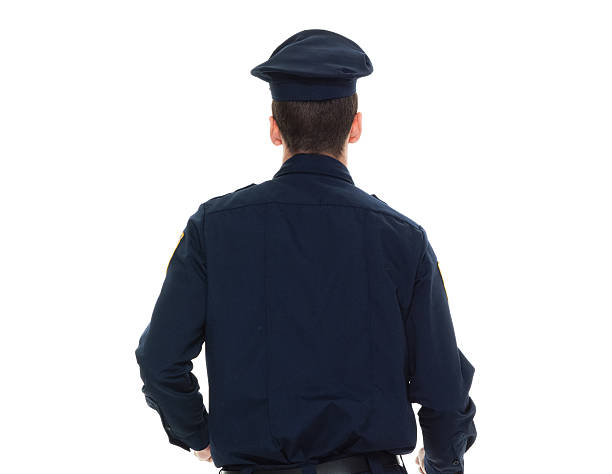 istock Rear view of police looking away 588384402
