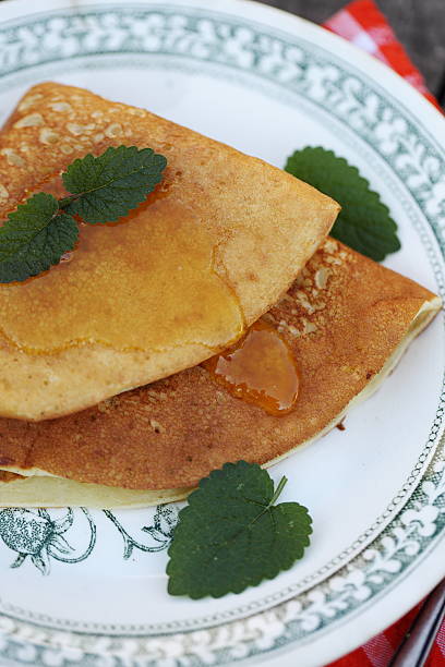 istock Pancakes with honey and mint 588385386