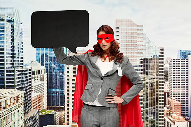 istock Superhero holding speech bubble outdoors 588388196