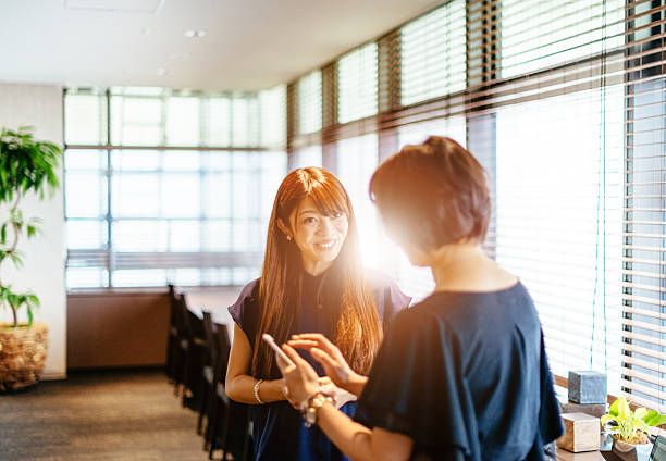 istock Two Japanese women in modern interior 588390622