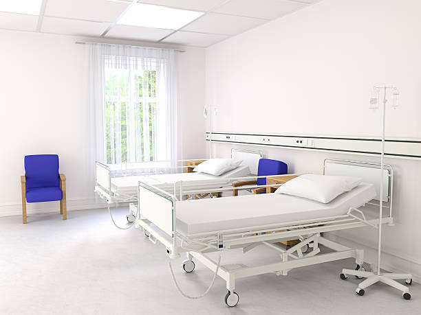 istock Empty hospital beds on hospital ward 588391268