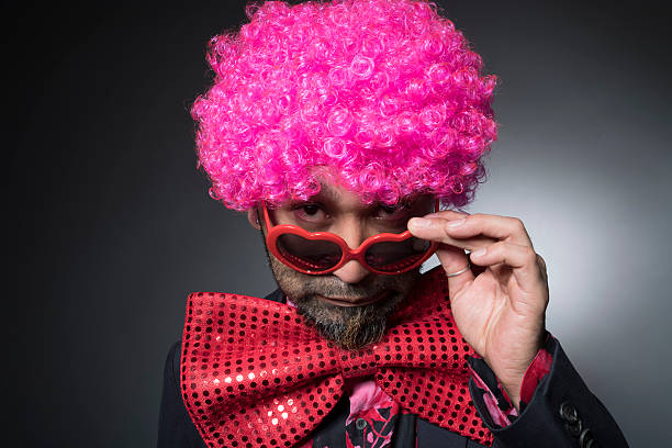 istock Man of Afro looking shifting the sunglasses 588391814