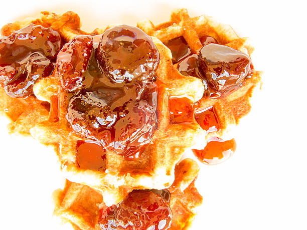 istock delicious belgian waffle with strawberry jam 588393056
