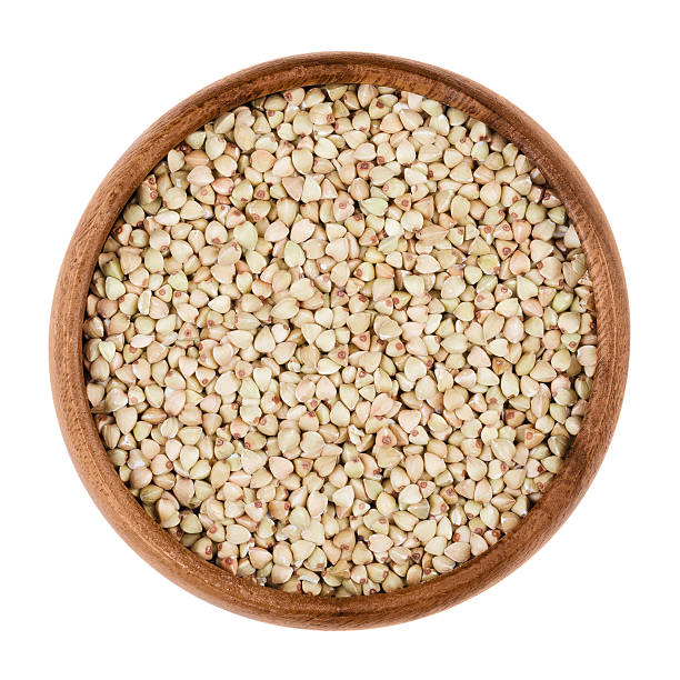 istock Buckwheat in a bowl on white background 588394376
