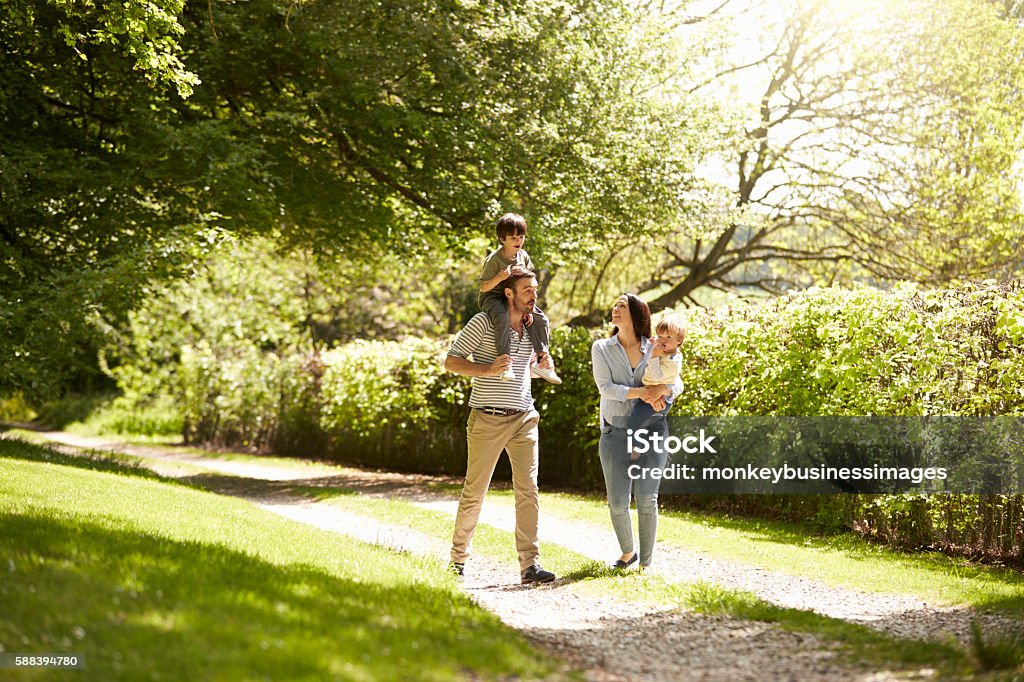 Family Going For Walk In Summer Countryside Young Family Stock Photo