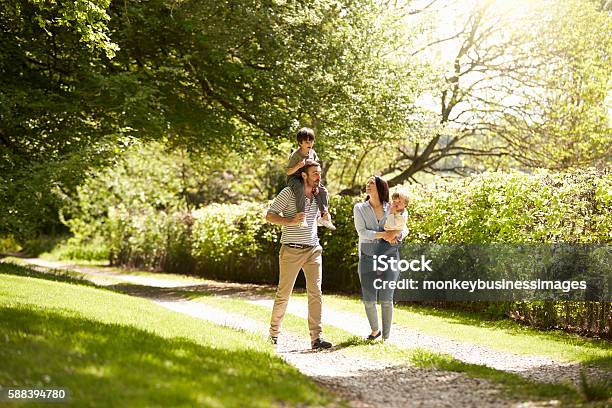 Family Going For Walk In Summer Countryside Stock Photo - Download Image Now - Young Family, Family, Footpath