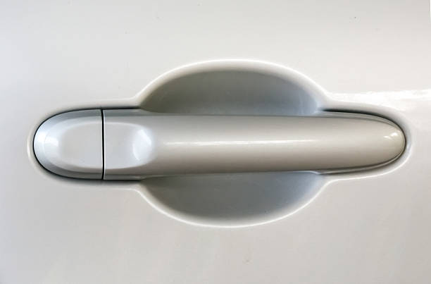 istock Car door handle in grey colour with copy space 588395150
