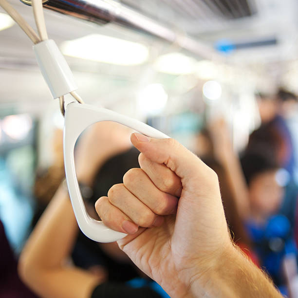 istock hand holding handle in the public metro 588395354