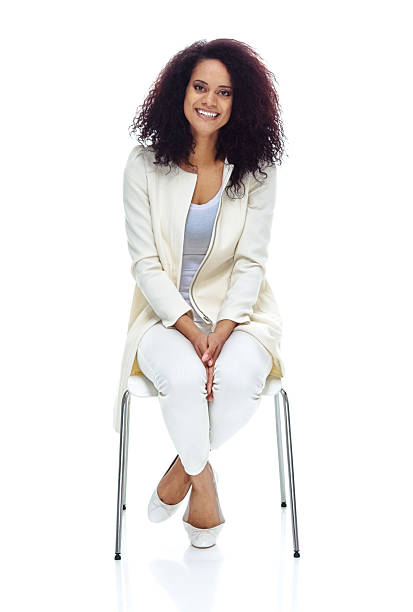 istock Smiling woman sitting on chair 588395964