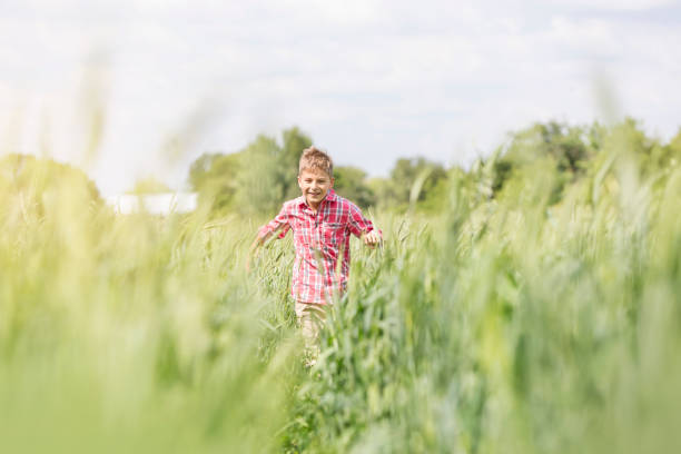 A Portrait of a little boy having fun at the sunset time