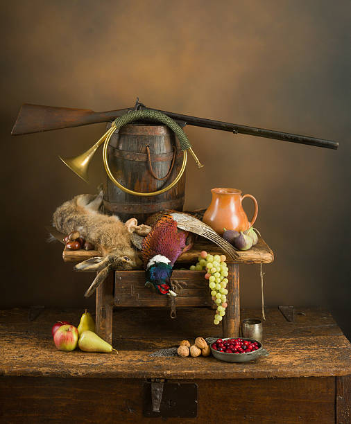 Autumn still life with hunting rifle, pheasant and hare