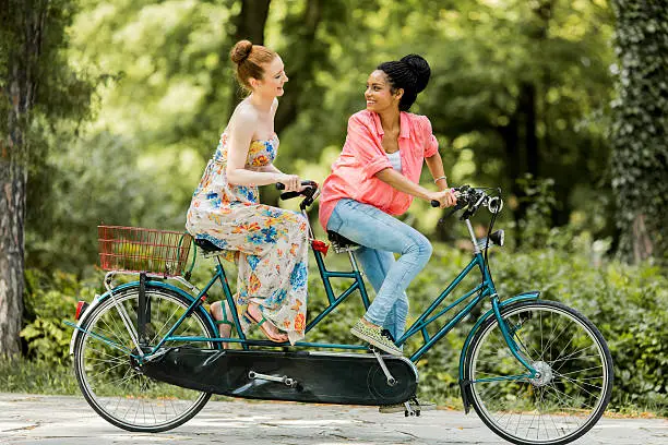 Young women riding on the bicycle