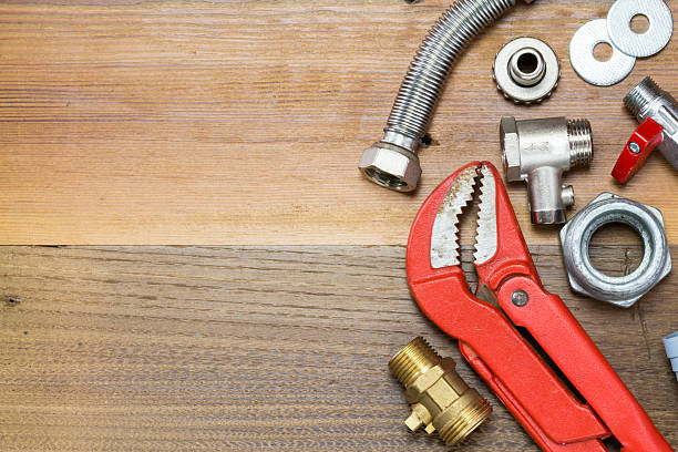 istock Thermostatic valve and plumber  tools on wooden background 588578232