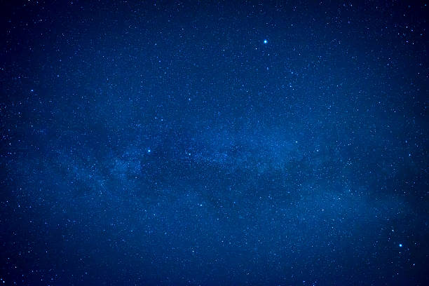 istock Blue dark night sky with many stars 588578846
