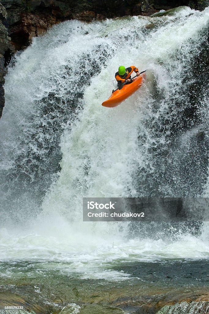Jump from the waterfall Jump from the waterfall in Norway, Ula river. Kayaking Stock Photo