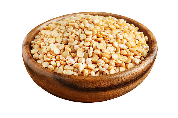 istock Dry peas in a wooden bowl 588579814