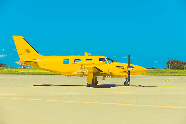 istock Yellow propeller plane parking at the airport 588587126