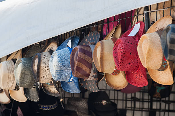 istock Wide brimmed hats hanging for sale 588588260