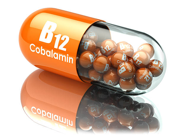 istock Vitamin B12 capsule. Pill with cobalamin. Dietary supplements. 588589810