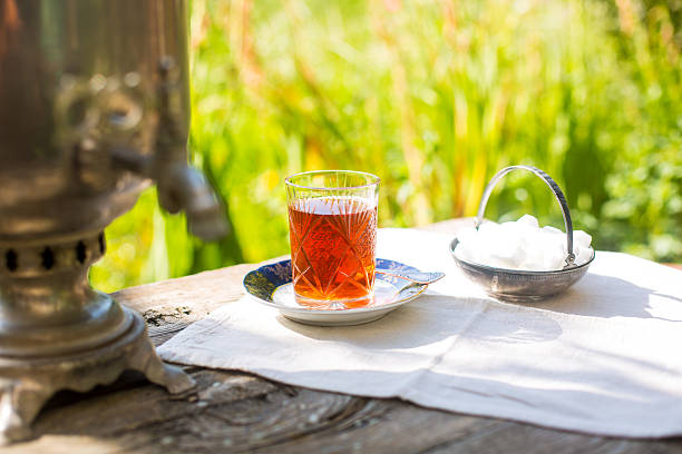 istock Black tea in crystal glass with blue saucer 588590822