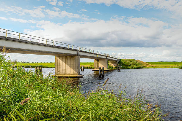 istock Modern concrete bridge over a Dutch canal 588591806