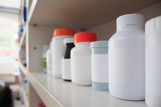 istock medicine bottles arranged on shelf at drugstore 588592336
