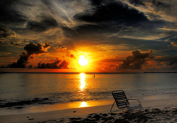 istock Beach chair and the setting sun 588592478