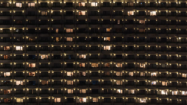 istock Multistorey block of flats at night 588592620