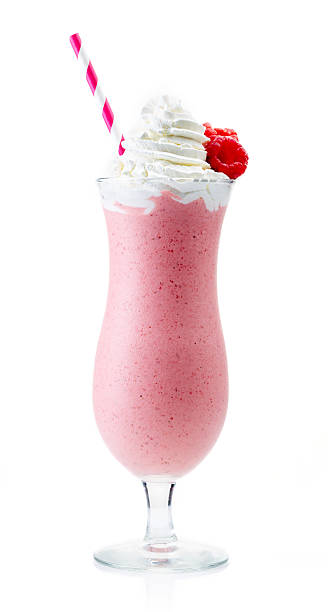 istock Glass of raspberry milkshake with whipped cream and raspberry, i 588593078
