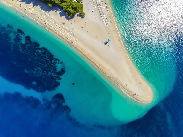 Famous beach Zlatni rat (Golden Horn or Golden Cape), Bol, Brac island, Dalmatia, Croatia, Europe. High angle view from quadcopter Phantom 2 with GoPro Hero 3 Black camera.