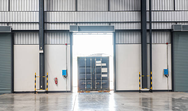 istock Container box on truck at loading dock shipping industry warehouse 588597196