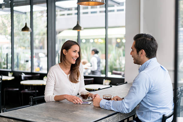 istock Couple having a cup of coffee at a cafe 588598062