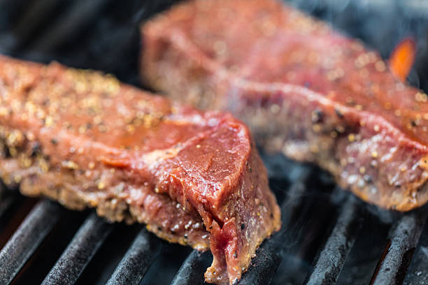 istock Raw sirloin steaks on the bbq 588599950