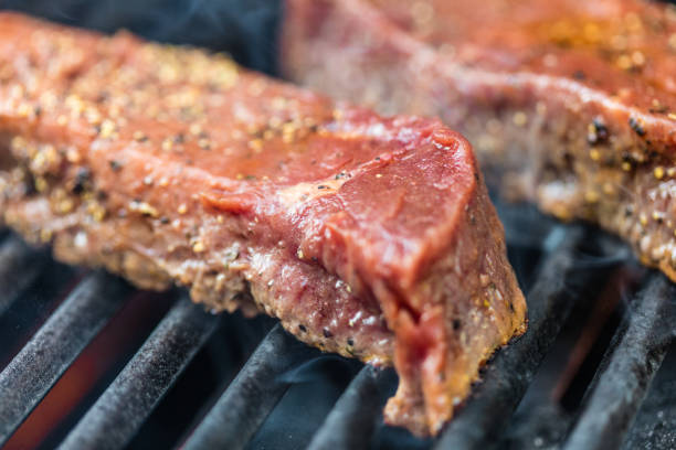 istock Raw sirloin steaks on the bbq 588600208
