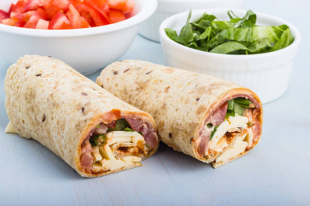 Wrap with tomato, lettuce, harissa and hoummous. stock photo